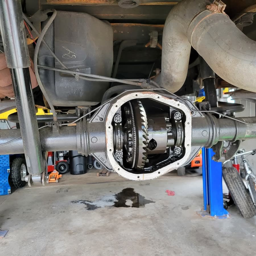 Rear differential opened for inspection and service under a truck